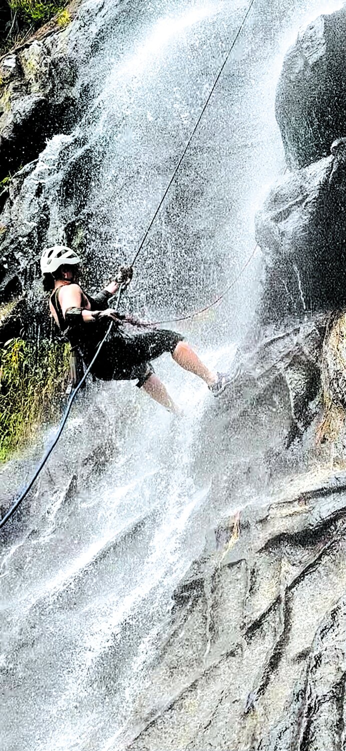 THAT WAS SOME HIKE: Lara rappels down a waterfall in Belize. She said she would have done it again if it hadn’t taken an hour’s hike through the jungle to get to the falls.